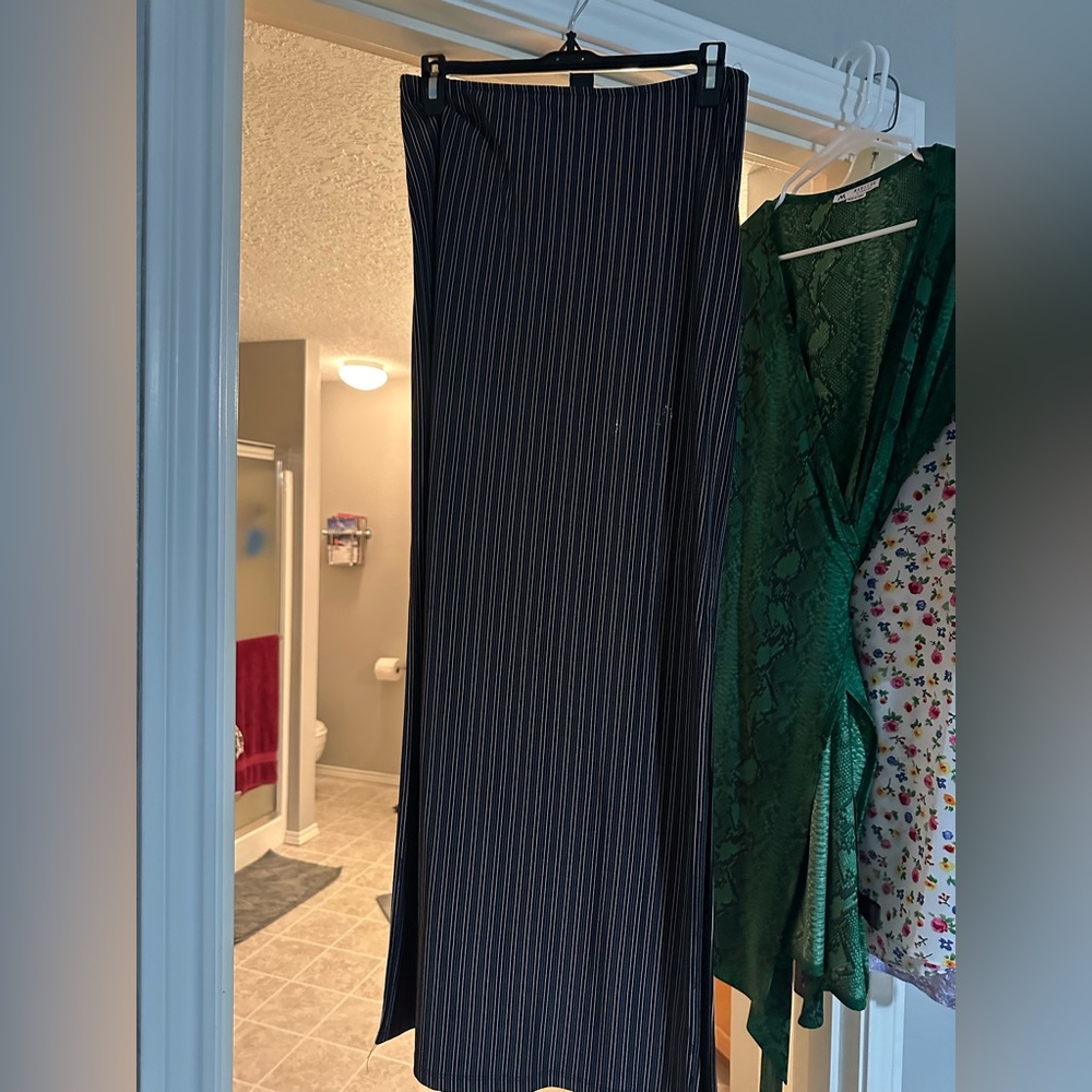 Floor length maxi skirt. Black with white pin stripes